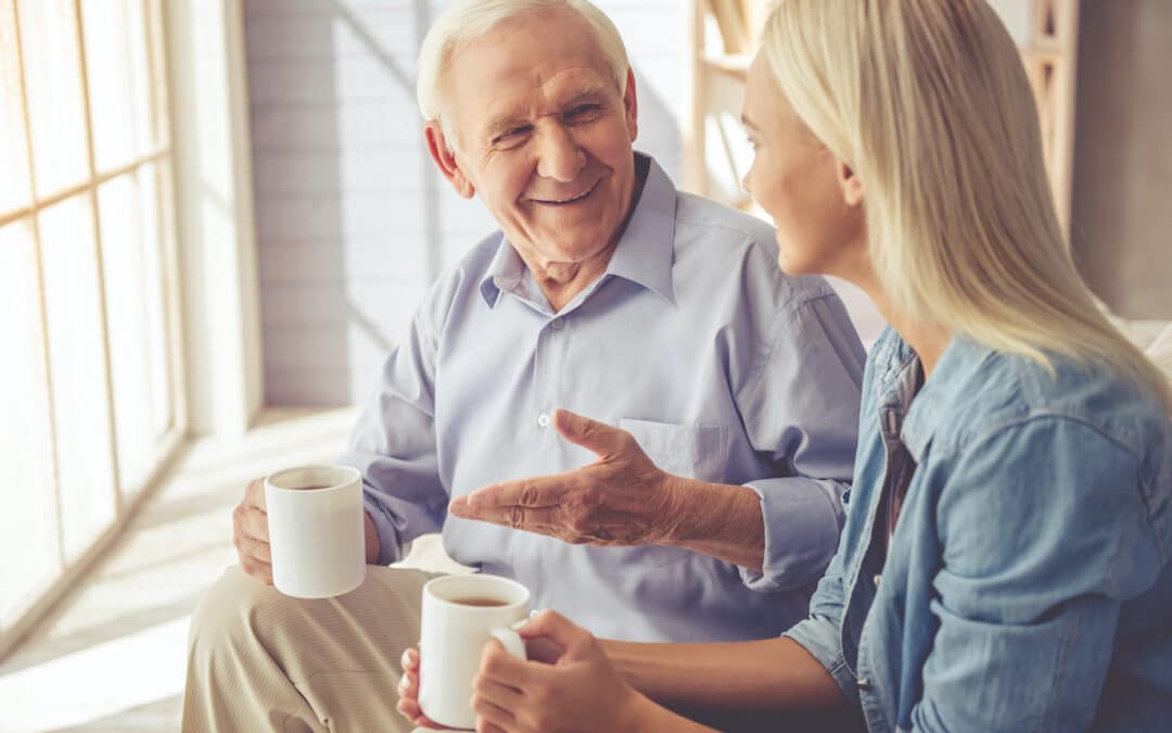 Senior Man and Adult Daughter Talk with Coffee_Ciel Senior Living